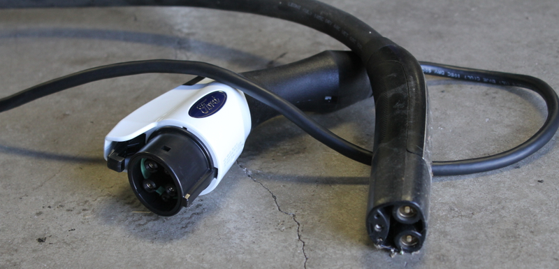 Ford charger (left) vs. Tesla charger (right). Photo credit: Stef Schrader